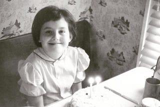 — — This photo shows me at my 5th Birthday party in 1956 at the home of my paternal grandparents in Escanaba, Michigan. Both of my grandparents were alive and well. Grandma would pass away a year later, and Grandpa two years later when I was sick with encephalitis. — -