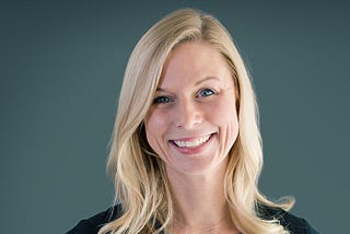 Color photo of Crystal Sumner, a blonde, blue eyed woman who is smiling, the author of this article and Head of Legal for Blend.