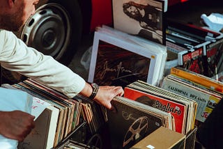 A man flips through old records