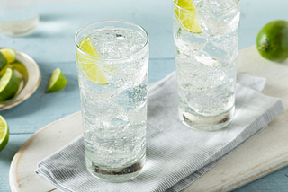 Sparkling water with lime in glasses