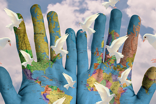 world peace — globe hands and white doves