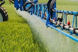 Why do farmers spray their crops?