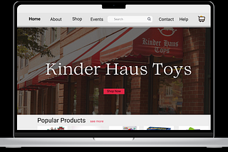 This image shows a screenshot of the Kinder Haus toys mid fidelity prototype. The prototype is displayed on a computer with a big red “shop” now button and the logo in the center. It also shows popular products at the bottom of the page.