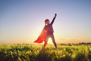 Young girl in superhero costume
