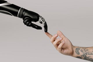 bionic hand and human hand finger pointing: Best AI Copywriting Software