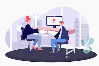 An illustration showing a designer and developer working together at one desk.