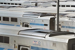 Parked trains in a train yard.