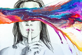 Black and white illustration of a woman holding index finger to her lips & a splash of multiple colors streaks over her eyes