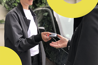 Person handing over car keys to share a car