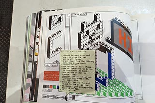 A photo from an old design book that shows an early website that encouraged people to play with text in a lego-inspired font.