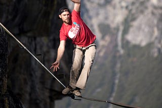 Photo of man on tightrope