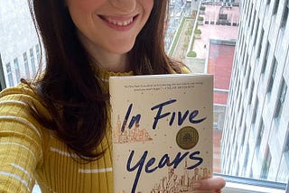 Rebecca Serle holding her book-In Five Years