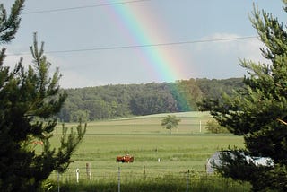 Rainbow over country fields