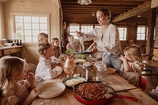 Selling beliefs as lifestyle pictured is large family eating traditional meal
