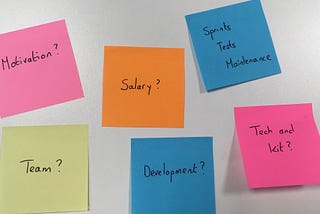 Picture of 6 post it notes with questions. Motivation? Team? Salary? Tech and kit? Development? Sprints, tests, maintenance?