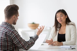 Shutterstock image 1063889165 — Caucasian men meeting with Asian woman