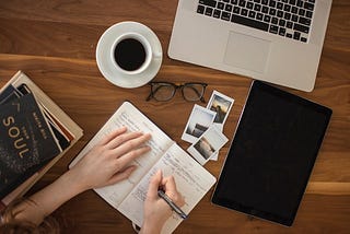 Two notebooks on a coffee table