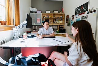 Donny Bui, an academic success coach in the Center for Academic Success and Transition, meets with Kyanne Casperson, a senior studying sociology.
