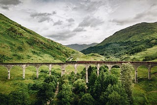 A bridge with a train crossing it.