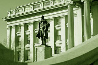 A statue of Alexander Hamilton stands in front of the Treasury building — its first Secretary. (Karen Nutini, Public domain, via Wikimedia Commons).