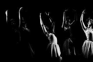 young diverse group of women dancing in ballet outfits