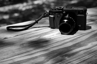 An X-Pro2 sitting on a picnic table.