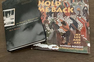 Copies of “Pearl’s Secret” by Neil Henry and “Don’t Hold Me Back” by Winfred Rembert