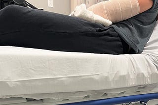 Teen girl in hospital with dislocated elbow.