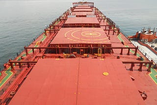 Orange colored massive holds of a cargo ship are shown