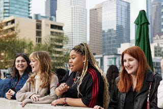 Photo of students with Los Angeles skyline in background.