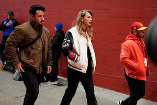 Taylor Swift wore Travis Kelce’s Christmas letterman jacket to Chiefs’ NYE game