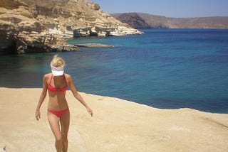 Photo of the author walking the rocky beach of Almeria, Spain.