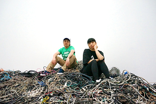 exonemo sits atop a pile of wires and cables