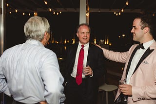 John Polonis patting his dad on the back