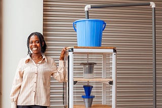 Ashesi alumna wins an award for pollution-fighting water filtration research presentation.