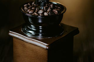 Coffee beans in a coffee grinder