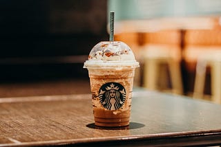 A Starbucks drink sitting on a table