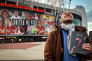 Karlo Tasler outside Old Trafford holding his book ‘Beyond Cristiano’