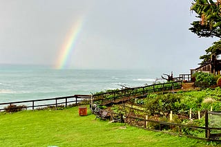 Rainbow over a stormy Pacific Ocean