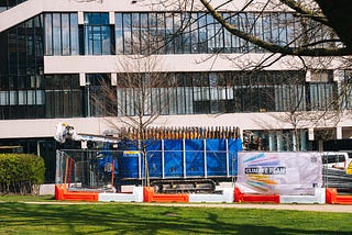 A drill, fenced off from the public, is pictured before a University of Leeds building