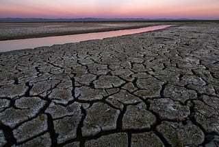 Cracked ground during a sunset