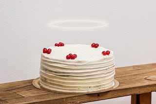 A decorated cake with a halo over it.