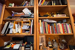 Image by the author, of the author’s bookshelf. Bonus points if you can actually identify how many hobbies/projects/careers are represented in these 8 shelves…