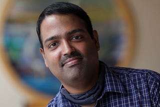 Portrait photo of Andrew Chacko.