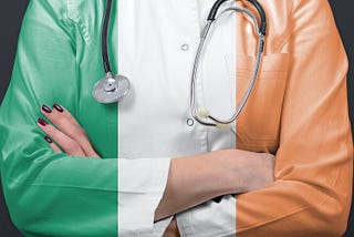 Picture of doctor wearing doctors coat in Ireland flag colours