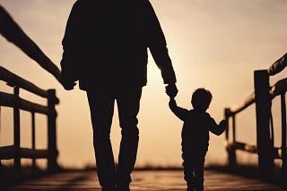 Father and son walking