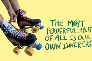 A banner stating “The Most Powerful Muse Of All Is Our Own Inner Child” next to a pair of roller-skates.