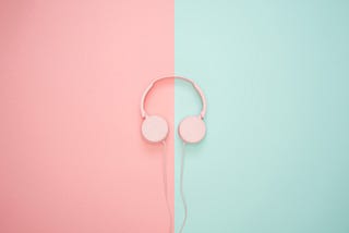 pink headphones on a pink and teal background