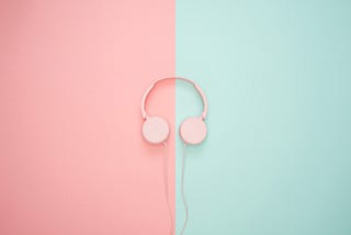 pink headphones on a pink and teal background