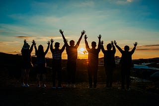 A group of friends looking at a sunset